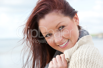 Young smilng female over sea background