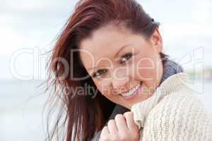 Young smilng female over sea background