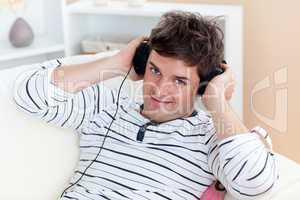 man listening music with headphones