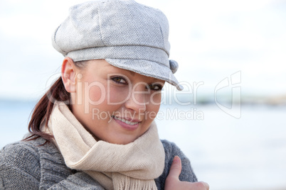 Young smilng female wearnig hat