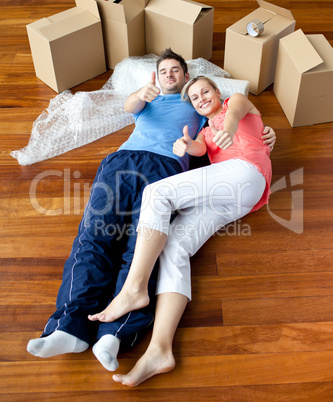 happy couple lying on the floor