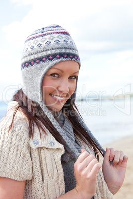 Young smilng female wearnig hat