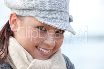 Young smilng female wearnig hat