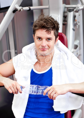 man sitting on a bench press  after exercises
