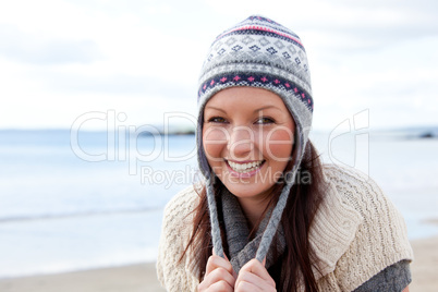 Young smilng female wearnig hat