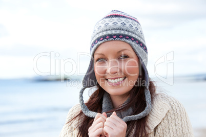 Young smilng female wearnig hat