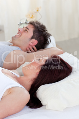 man lying on the bed with his woman