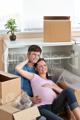 couple sitting on the floor in their new house