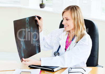 Smiling female looking at X-ray