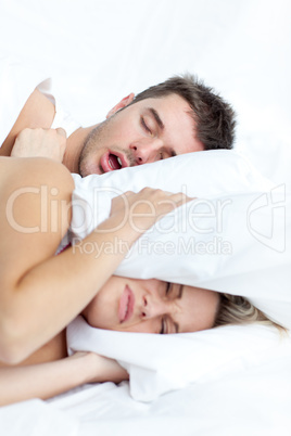 young couple lying in bed