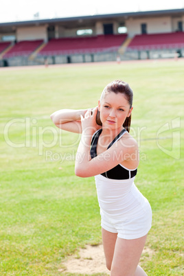 athletic woman during a shot put training
