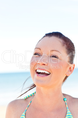 Beautiful smiling woman on the beach