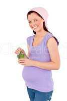 future mom holding gherkins in a glass