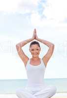 smiling woman doing yoga exercise
