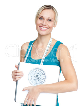 young woman holding a weight scale