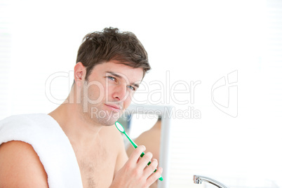 male brushing his tooth