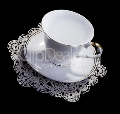 White cup on small doily