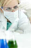 Female Scientist or Doctor With Test Tube In Laboratory