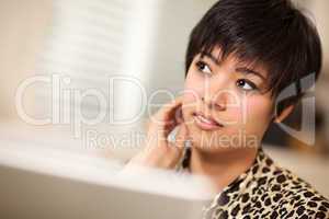 Pretty Smiling Multiethnic Woman Using Laptop