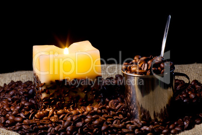 cup wtih coffee bean and candle