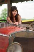 Young woman with old car.