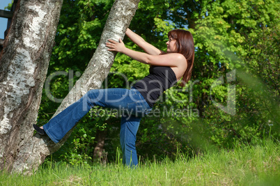 Young woman with tree.