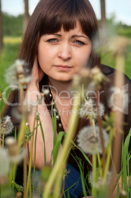 Portrait of beauty girl with dandelions.