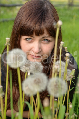 Portrait of beauty girl with dandelions.