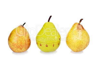 Two ripe fresh pears and green plastic pear timer