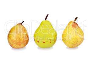 Two ripe fresh pears and green plastic pear timer