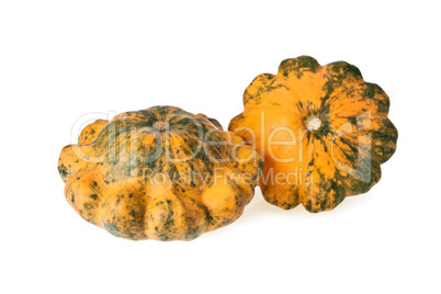 Two motley scalloped squashes isolated on white