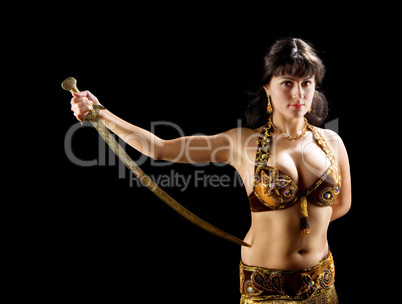 beautiful  brunette woman stand with sword