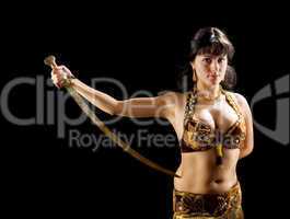 beautiful  brunette woman stand with sword