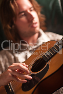 Young Musician Plays His Acoustic Guitar