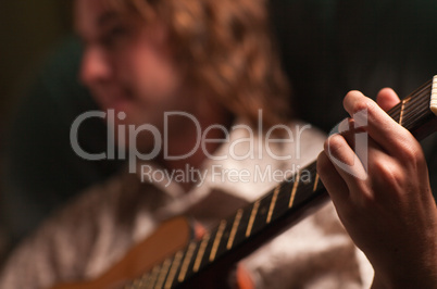 Young Musician Plays His Acoustic Guitar