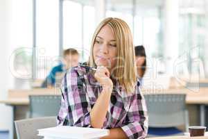 High school - Thoughtful female student in classroom