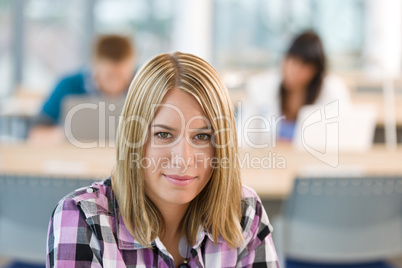 Thoughtful female student in classroom