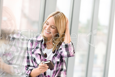 Happy female teenager listen to music