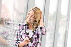 Happy female teenager listen to music