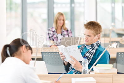 Three high school students in classroom