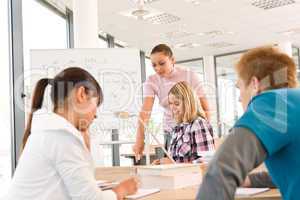 High school students with professor in classroom