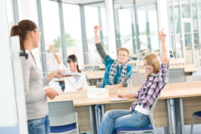 High school students raising hands