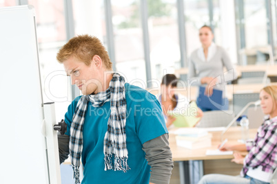 High school students with professor in classroom