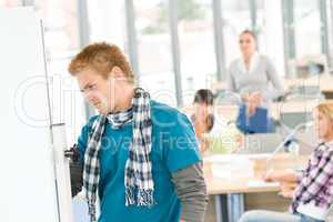 High school students with professor in classroom