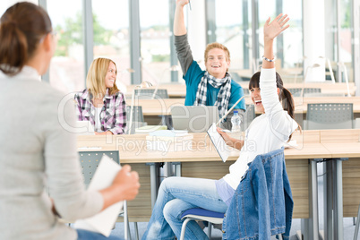 High school students raising hands
