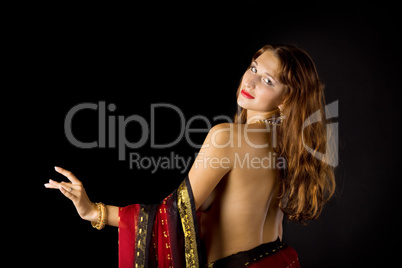 Pretty young woman with naked spine in traditional dress