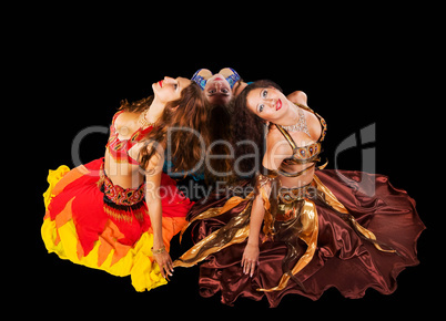 Three young woman in arabic costume
