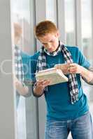 Male teenager read book