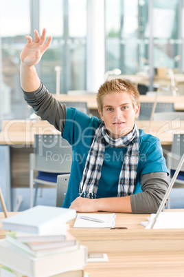 Hand raised - male student in classroom