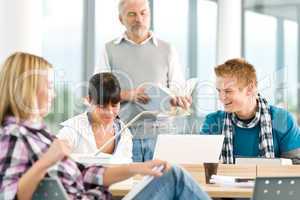 High school - three students with mature professor